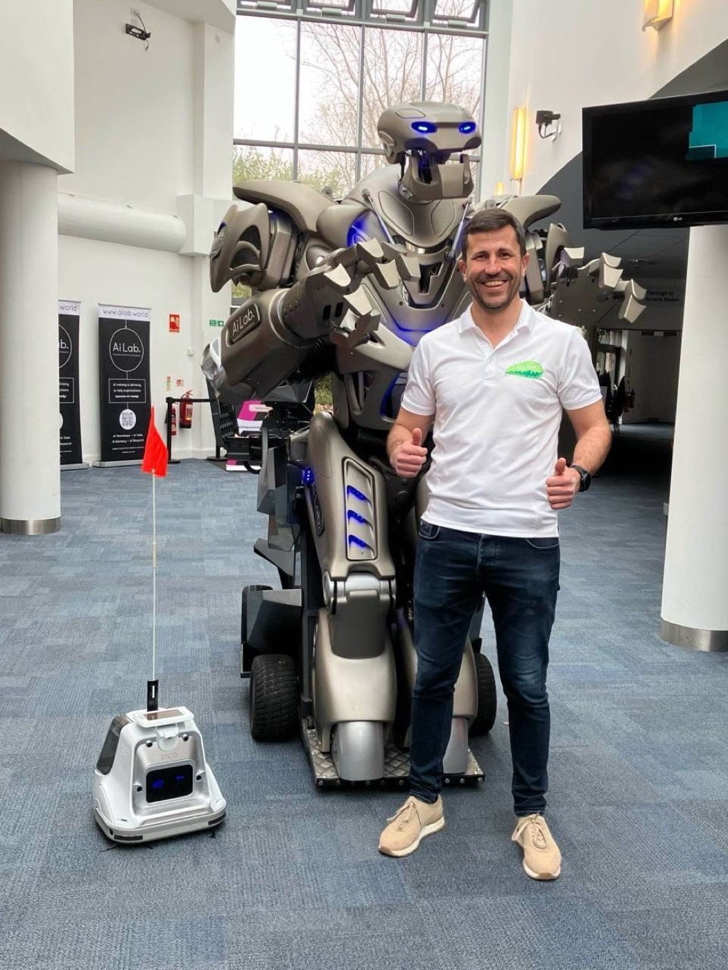Antoni Dimitrov with Eco Drift's autonomous cobot and the Titan robot at Solent FutureScape